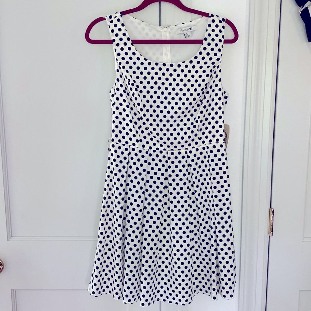 White and black polka dot dress. Size large. Brand new. With tags.